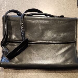 Tandi black leather briefcase featuring both top handles adjustable strap P-001